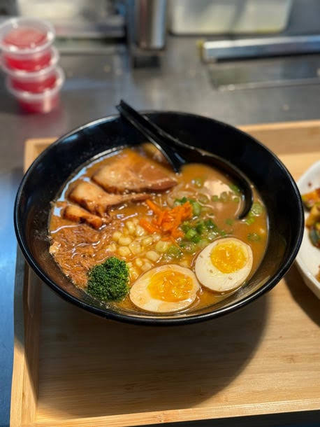 A bowl of ramen with delicious toppings
